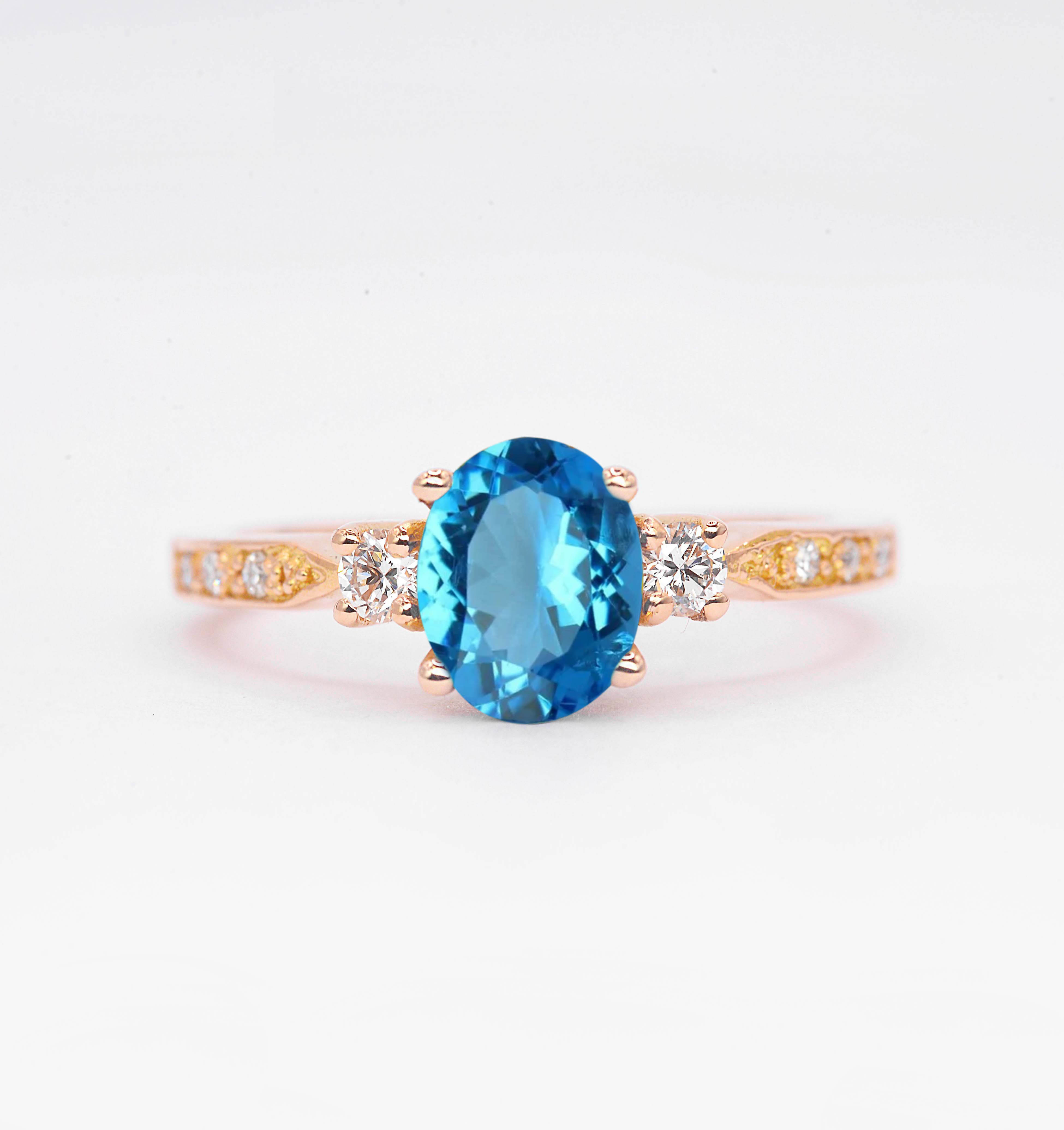 Oval blue topaz ring for her