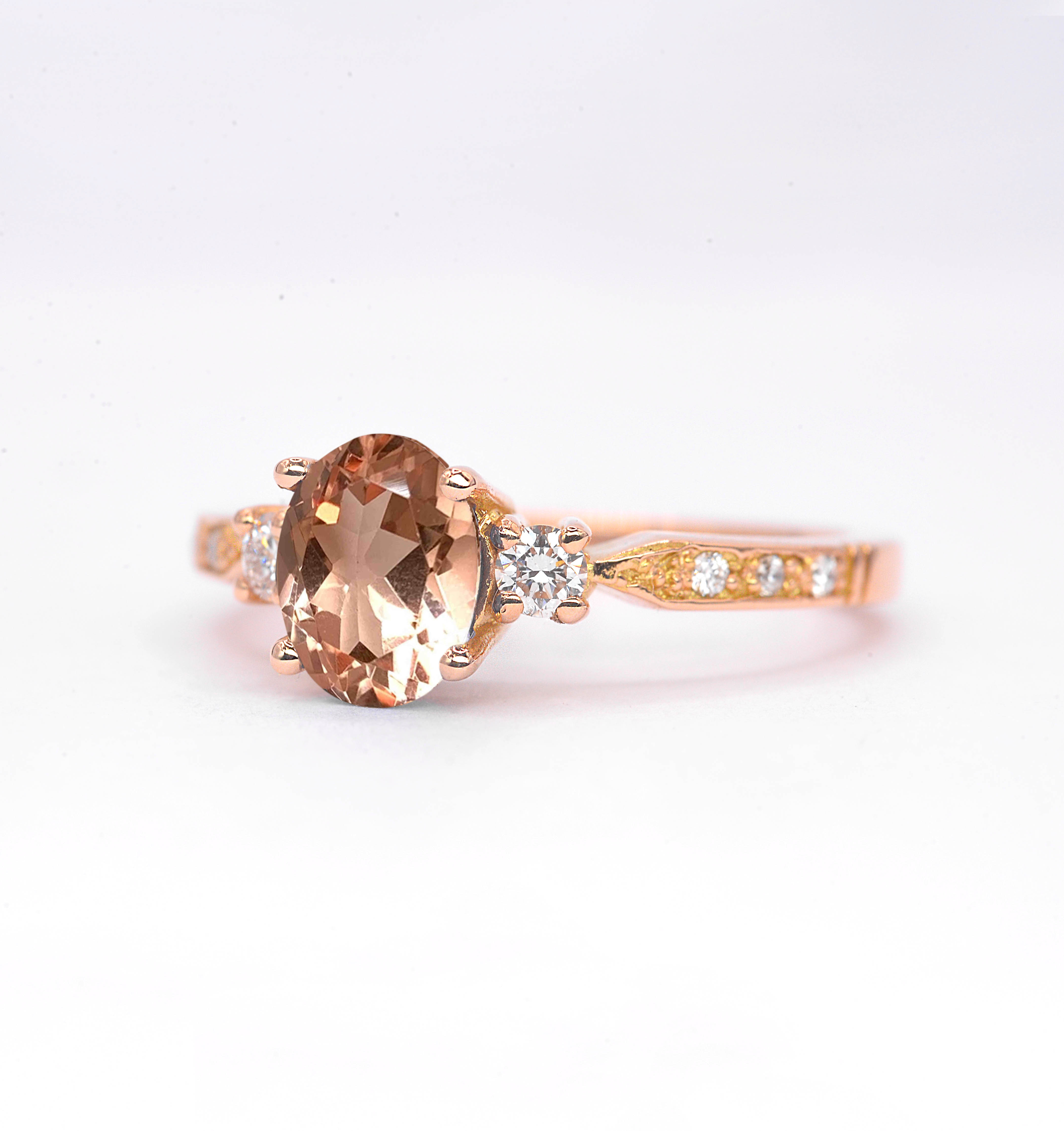 Natural morganite and diamond ring with 8 x 6mm oval cut morganite and white round diamonds. The unique design of this art deco style ring comes with solid 9k,14k or 18k gold or platinum.