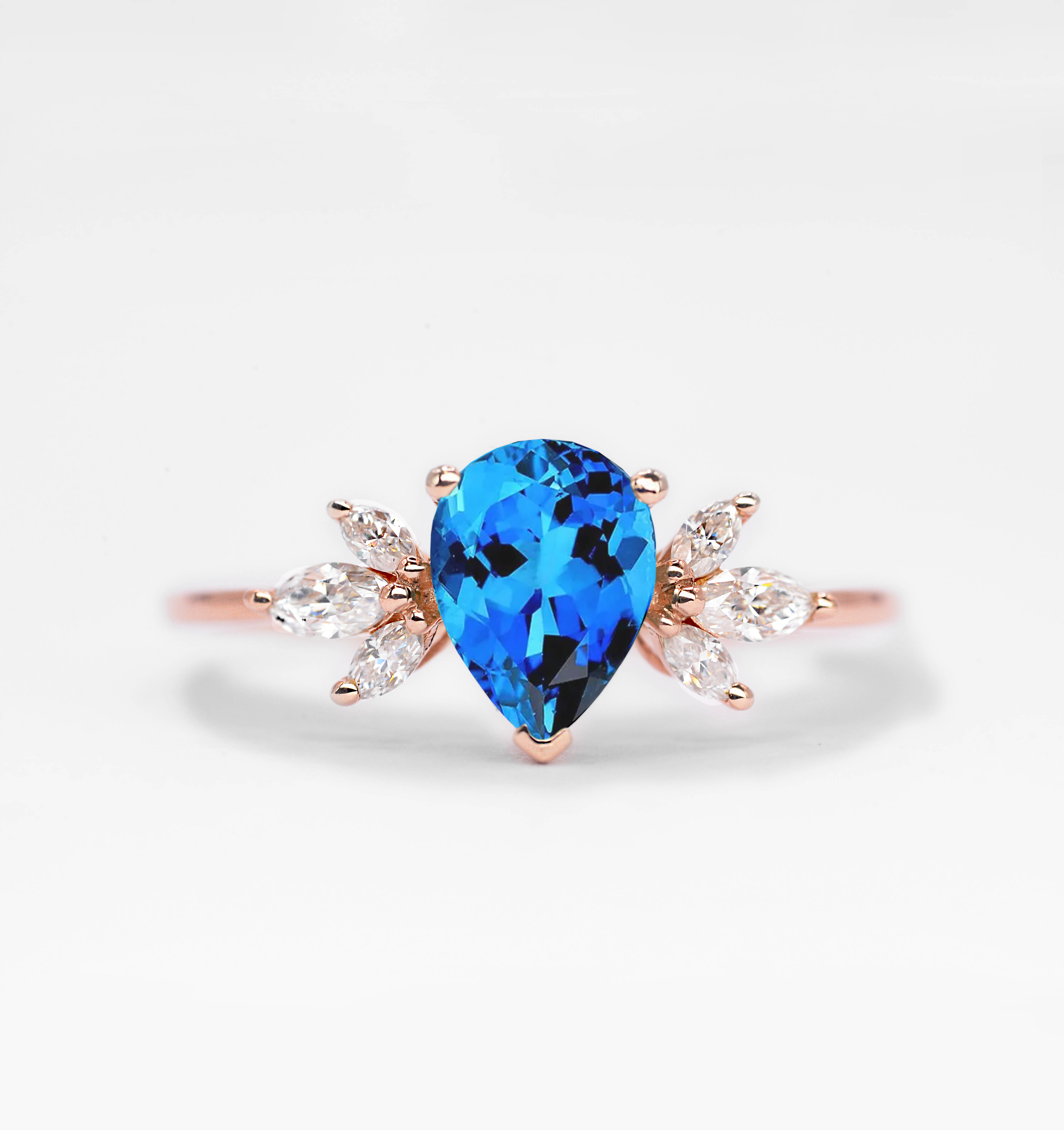 Pear blue topaz and diamond ring