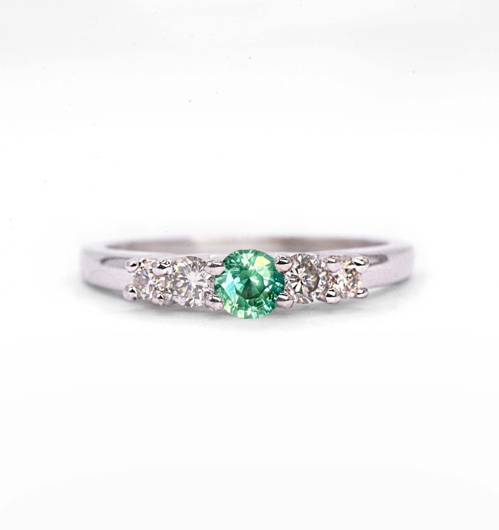 4mm round mint green sapphire and diamond ring with 4.5mm round green sapphire and white diamonds. The unique art deco style ring comes with solid 9k,14k or 18k gold or platinum.