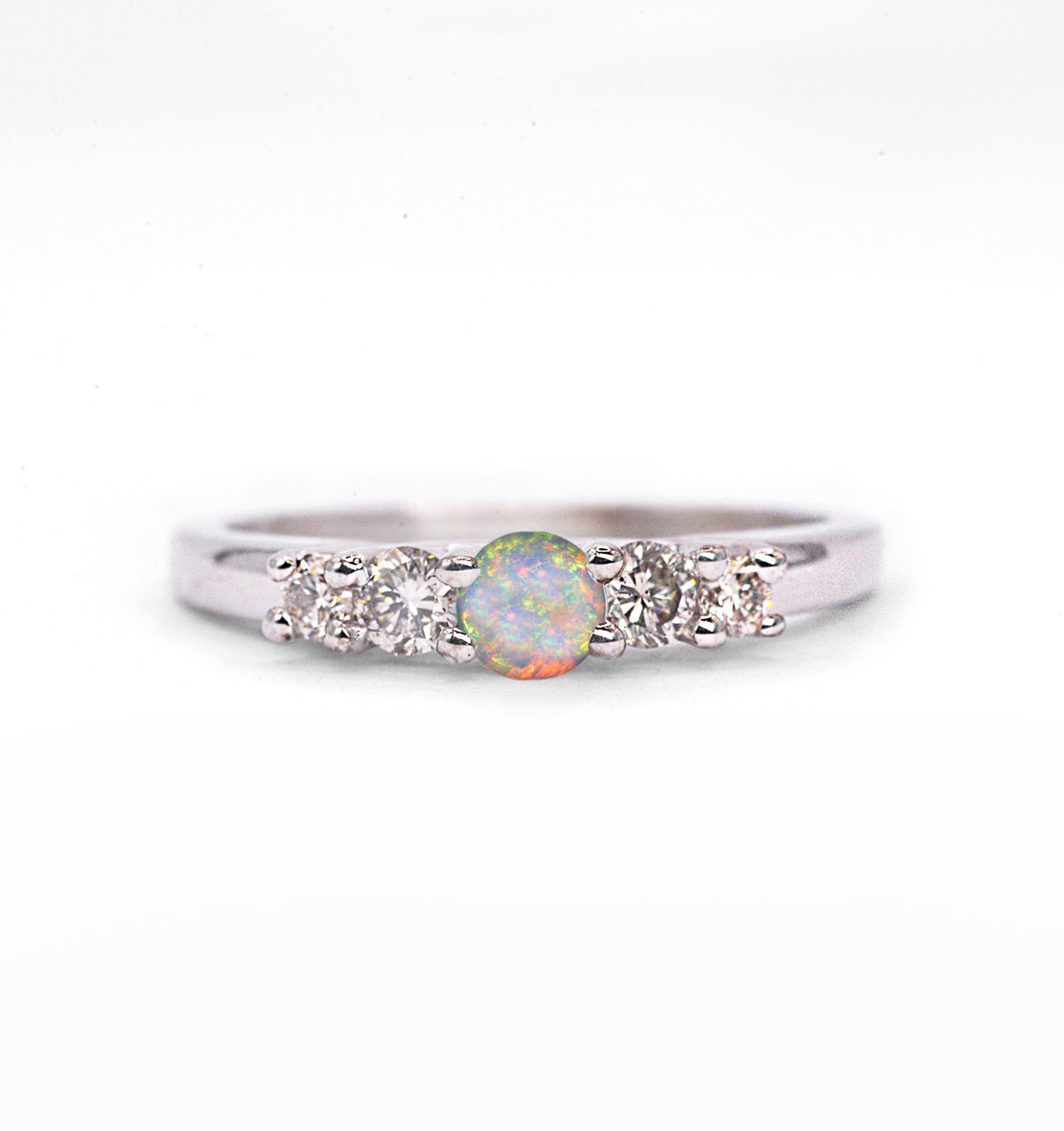 4mm white opal and diamond ring for her with natural opal and white diamonds. This unique ring comes in solid 9k,14k or 18k rose gold.