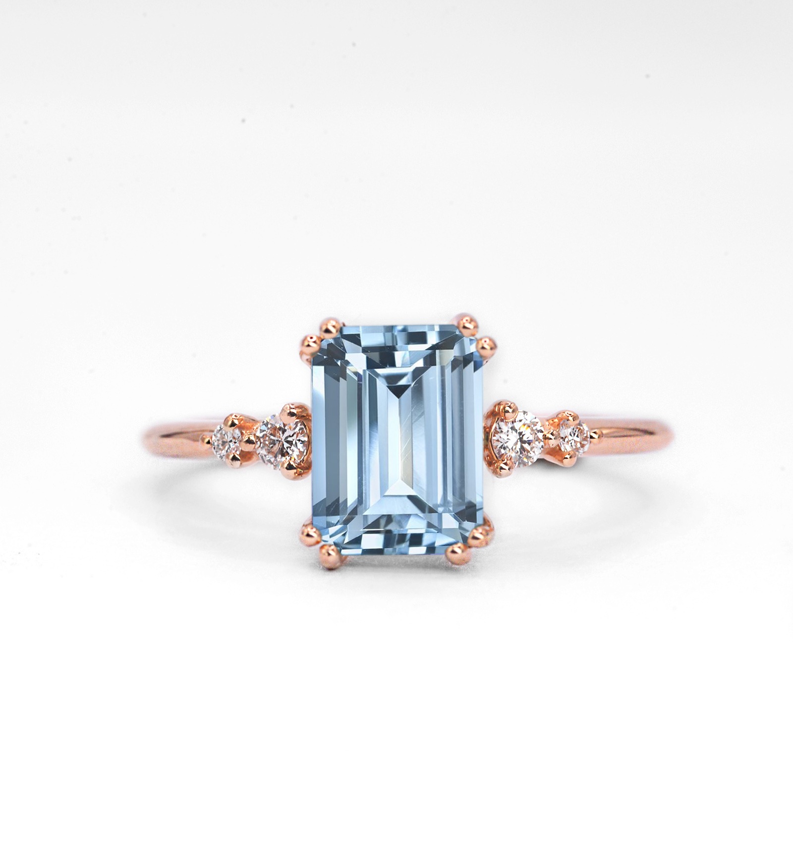 Aquamarine and diamond engagement ring with 8 x 6mm emerald cut golden aquamarine and white diamonds. The unique art deco style ring comes with solid 9k,14k or 18k gold or platinum.