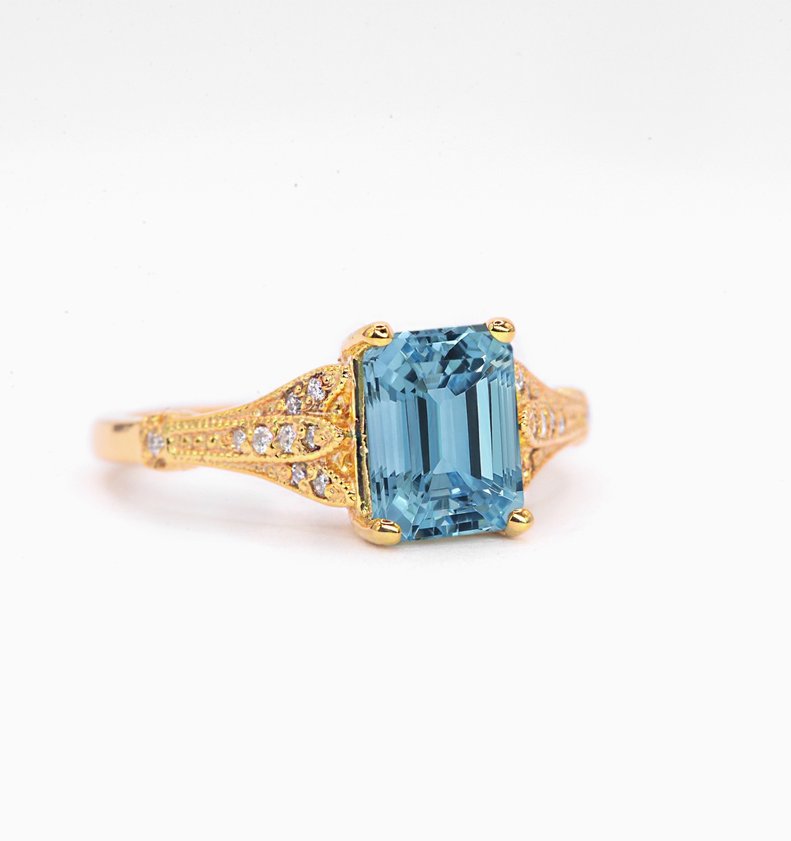 This emerald cut aquamarine vintage ring is a beautiful and elegant choice for engagement or any other occasion. Available in rose gold, yellow gold, white gold, or platinum.