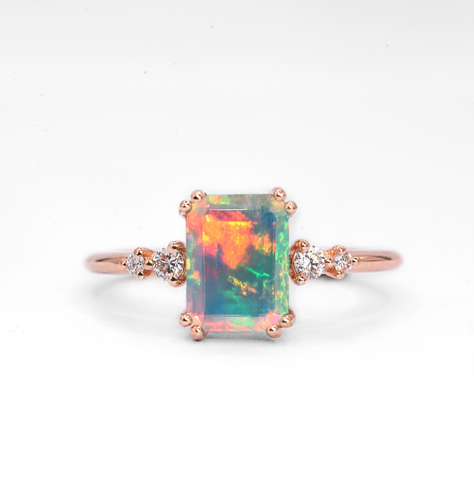 Emerald cut opal art deco ring for her with white opal and white diamonds. This unique art deco ring comes with solid 9k,14k or 18k rose gold.