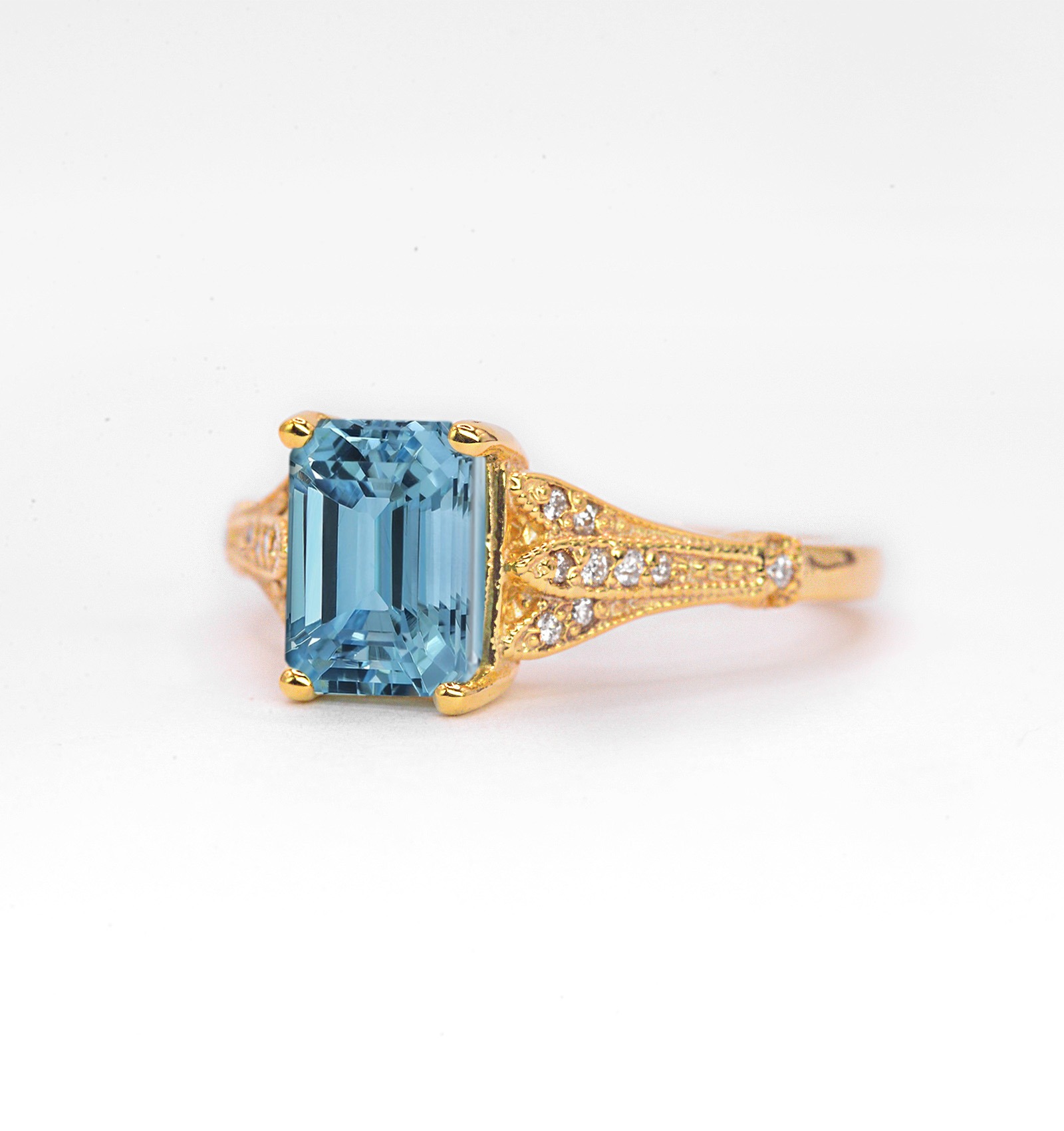 This emerald cut aquamarine vintage ring is a beautiful and elegant choice for engagement or any other occasion. Available in rose gold, yellow gold, white gold, or platinum.