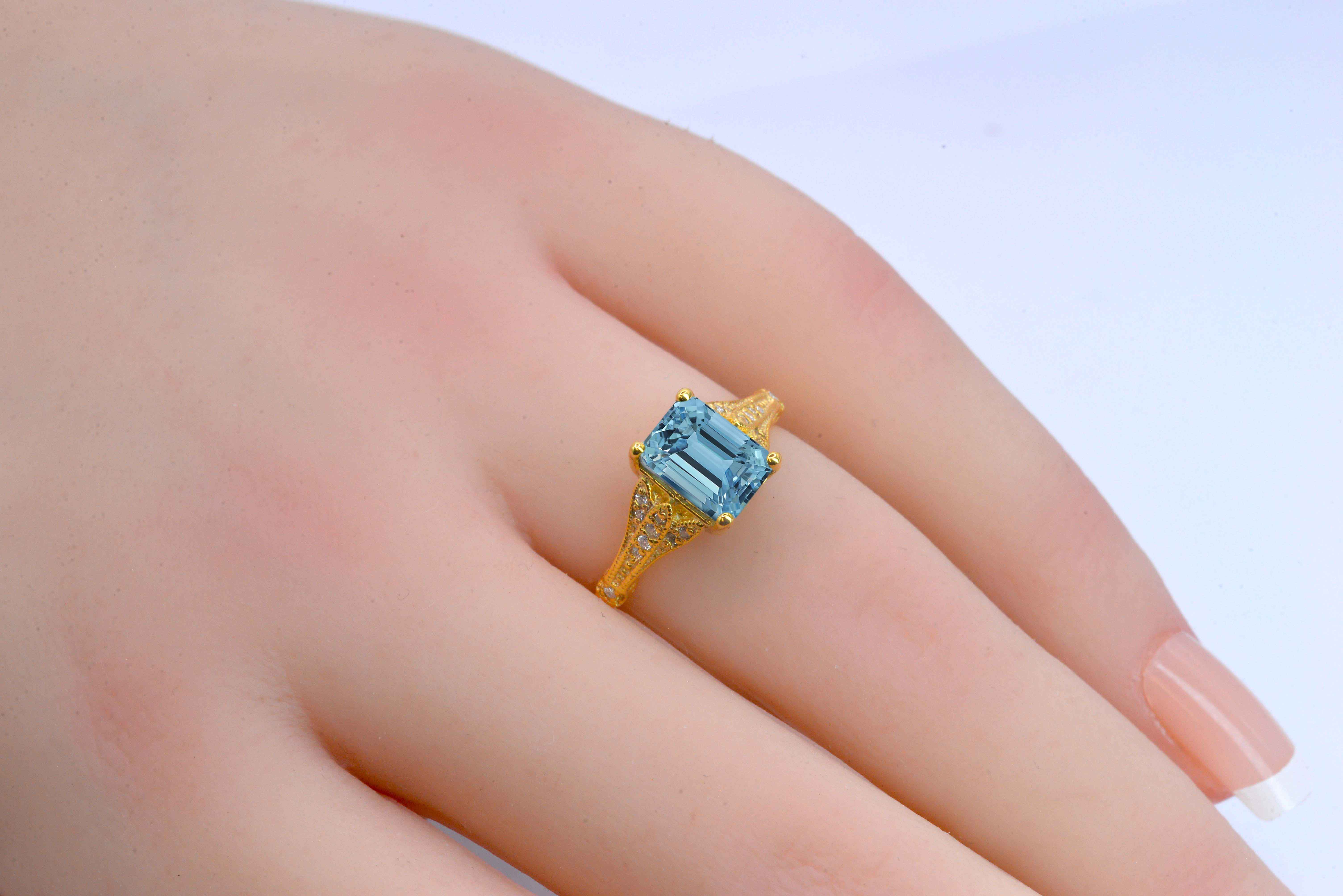 This emerald cut aquamarine vintage ring is a beautiful and elegant choice for engagement or any other occasion. Available in rose gold, yellow gold, white gold, or platinum.