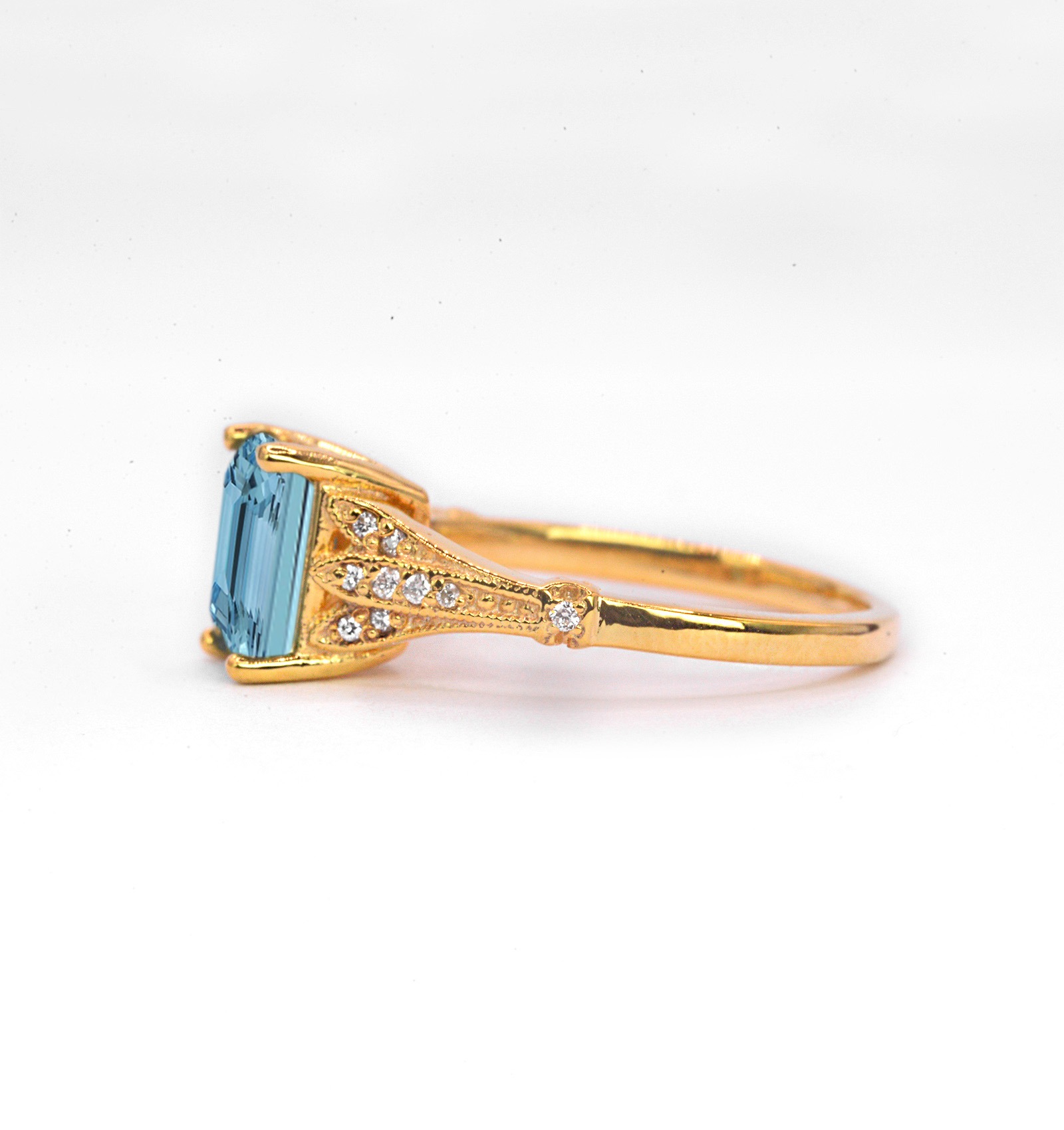 This emerald cut aquamarine vintage ring is a beautiful and elegant choice for engagement or any other occasion. Available in rose gold, yellow gold, white gold, or platinum.