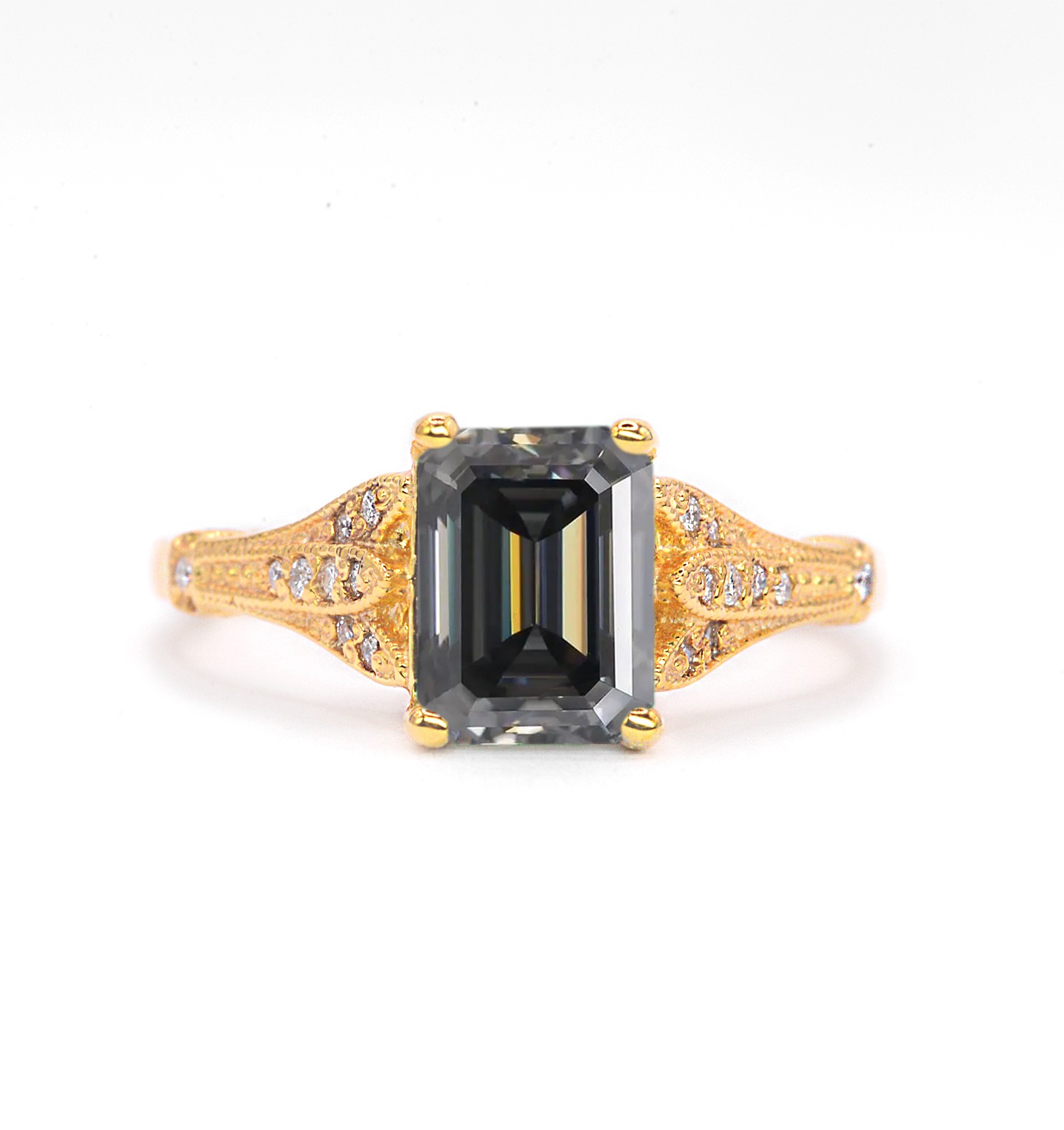 This emerald cut grey moissanite ring for wife comes with emerald cut grey moissanite and white natural diamonds. A beautiful and elegant choice for engagement or any other occasion. Available in rose gold, yellow gold, white gold, or platinum.