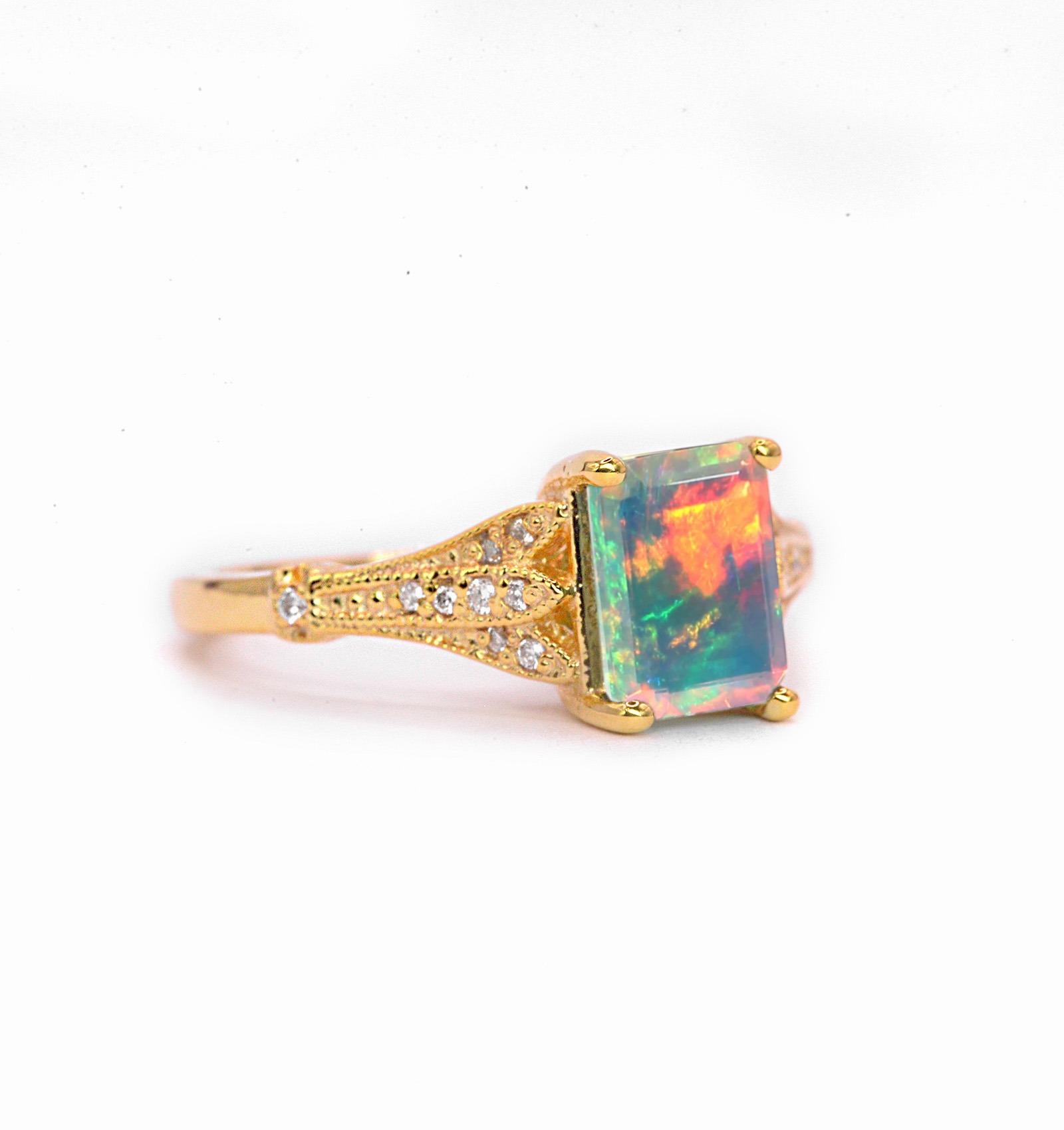 Natural opal and diamond vintage ring with 8 x 6mm natural white opal and white diamonds. The unique and elegant ring comes with solid 9k,14k or 18k gold or platinum.