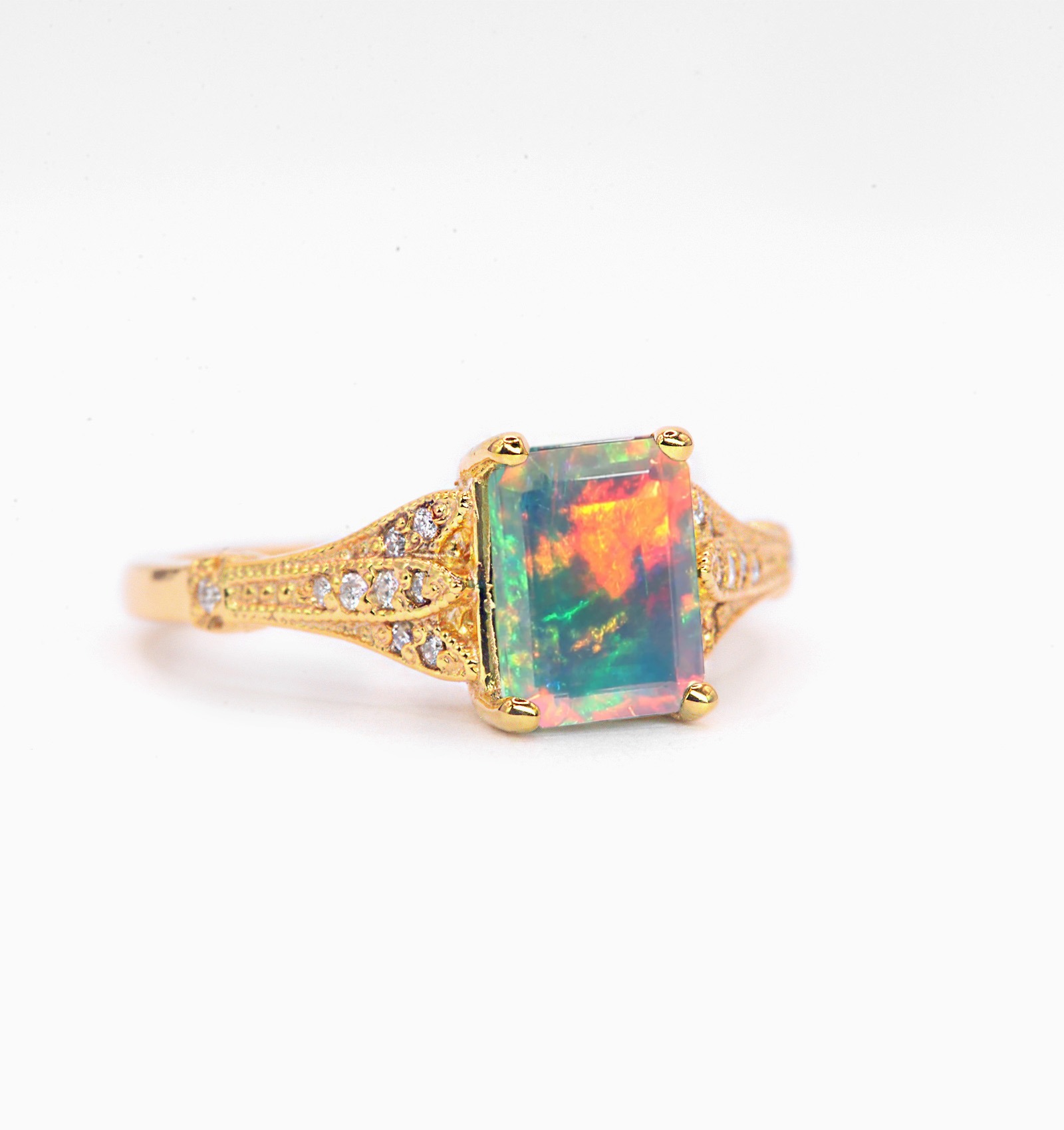 Natural opal and diamond vintage ring with 8 x 6mm natural white opal and white diamonds. The unique and elegant ring comes with solid 9k,14k or 18k gold or platinum.