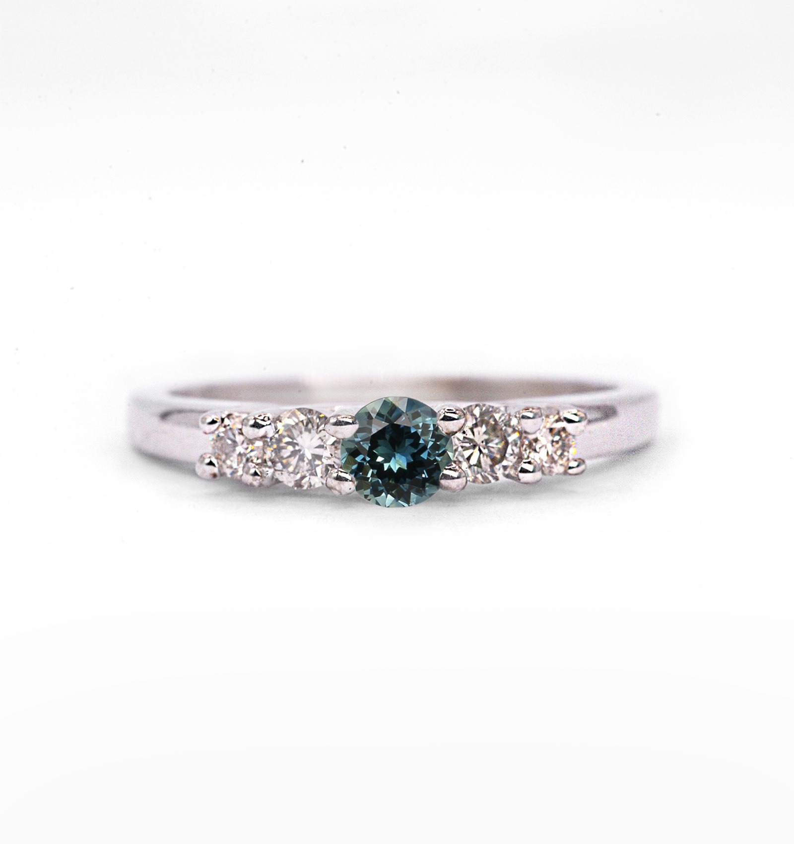 Teal sapphire and diamond band ring with 4mm round teal sapphire and white diamonds. The unique art deco style ring comes with solid 9k,14k or 18k gold or platinum.