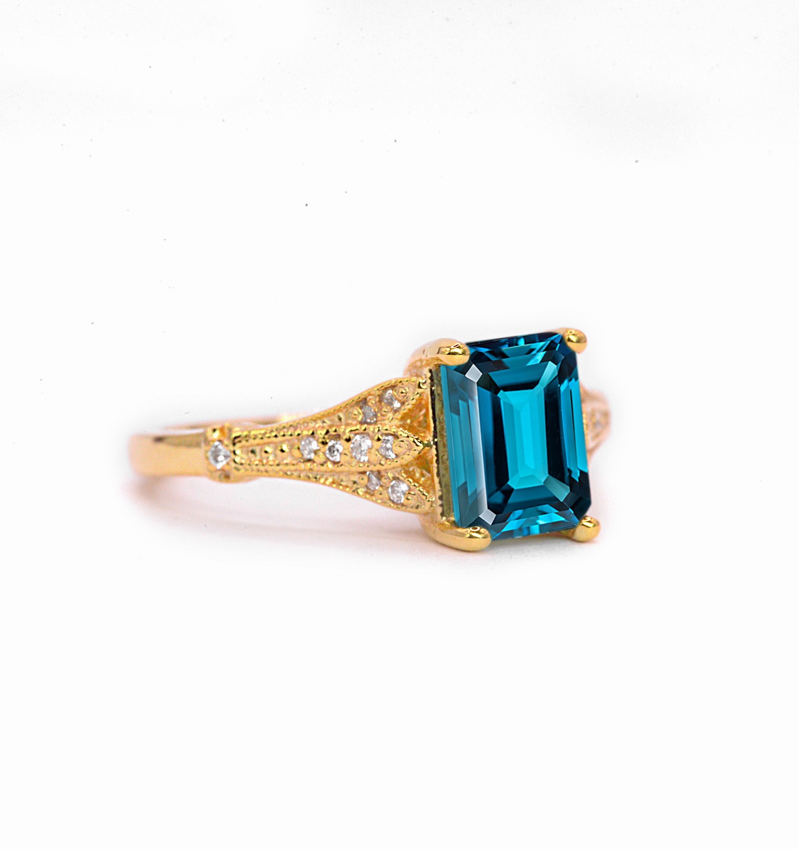 Emerald cut blue topaz and diamond ring for wife. This unique bespoke engagement ring comes with any solid 9k,14k or 18k gold or platinum.