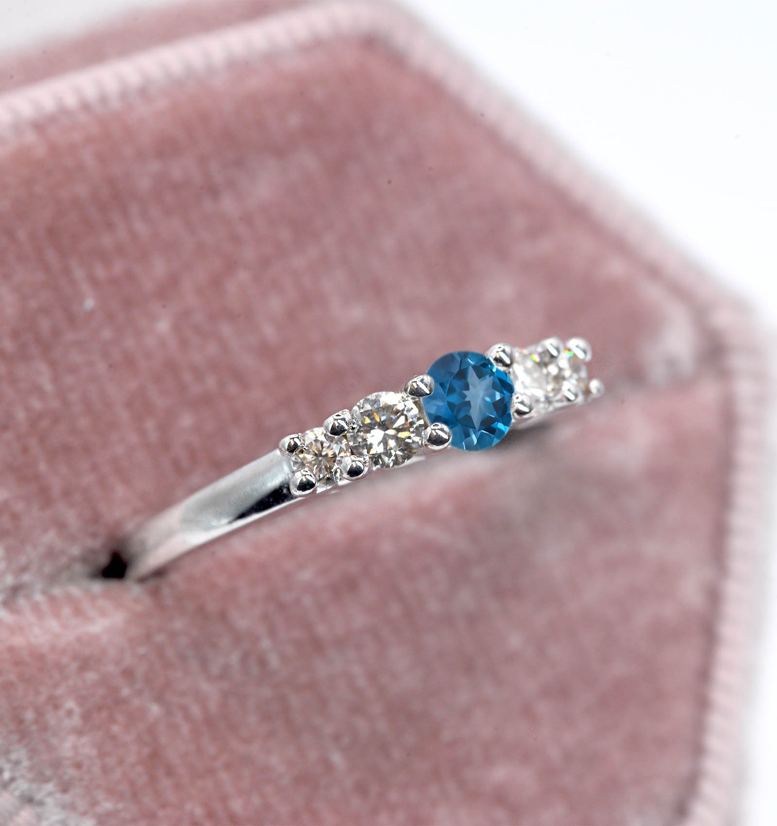 This natural blue topaz and diamond ring featuring round natural blue topaz and white diamonds. A beautiful and elegant ring for engagement or any other occasion. Available in rose gold, yellow gold, white gold, or platinum.