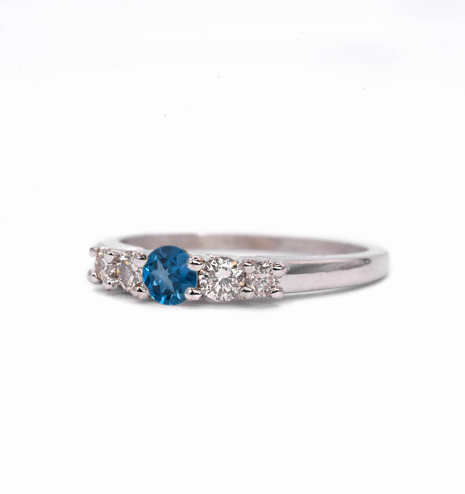 This natural blue topaz and diamond ring featuring round natural blue topaz and white diamonds. A beautiful and elegant ring for engagement or any other occasion. Available in rose gold, yellow gold, white gold, or platinum.