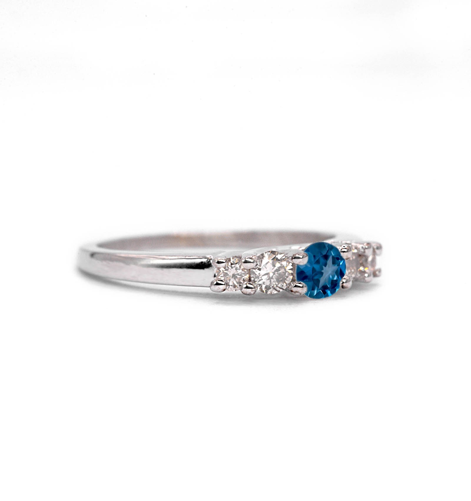 This natural blue topaz and diamond ring featuring round natural blue topaz and white diamonds. A beautiful and elegant ring for engagement or any other occasion. Available in rose gold, yellow gold, white gold, or platinum.