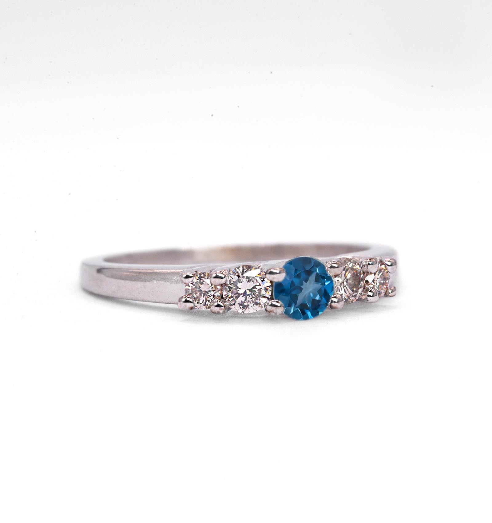 This natural blue topaz and diamond ring featuring round natural blue topaz and white diamonds. A beautiful and elegant ring for engagement or any other occasion. Available in rose gold, yellow gold, white gold, or platinum.