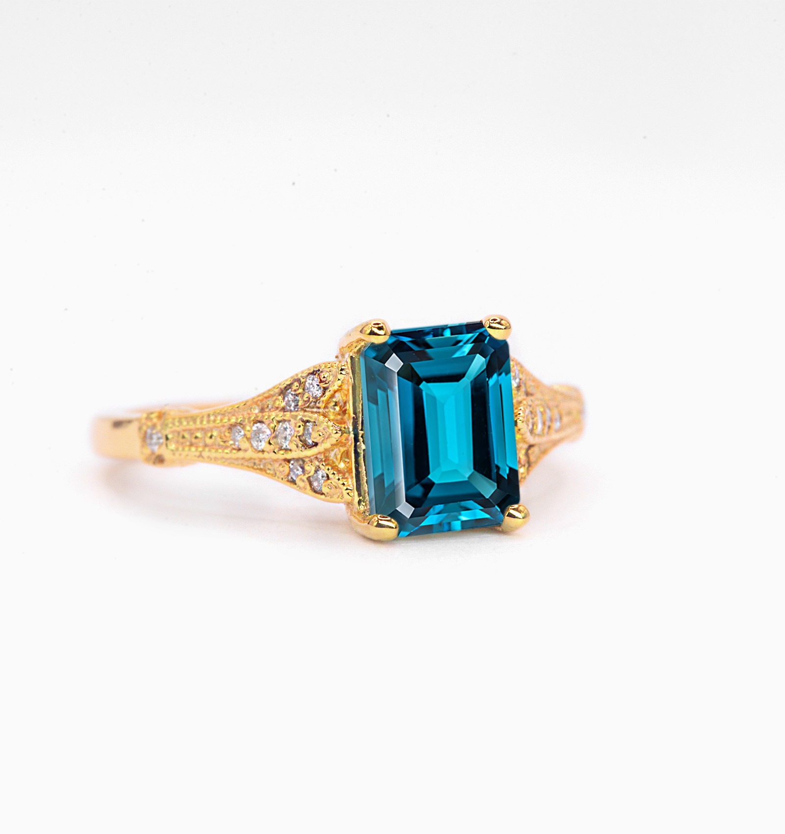 Emerald cut blue topaz and diamond ring for wife. This unique bespoke engagement ring comes with any solid 9k,14k or 18k gold or platinum.