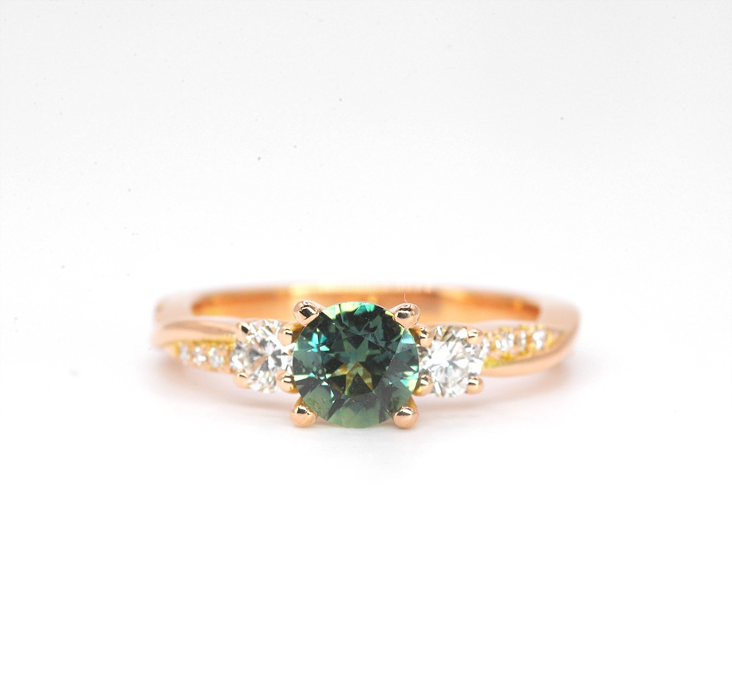 Round teal sapphire rose gold ring with 6mm natural teal sapphire and accent diamonds. The unique design of this art deco style ring comes with solid 9k,14k or 18k gold or platinum.