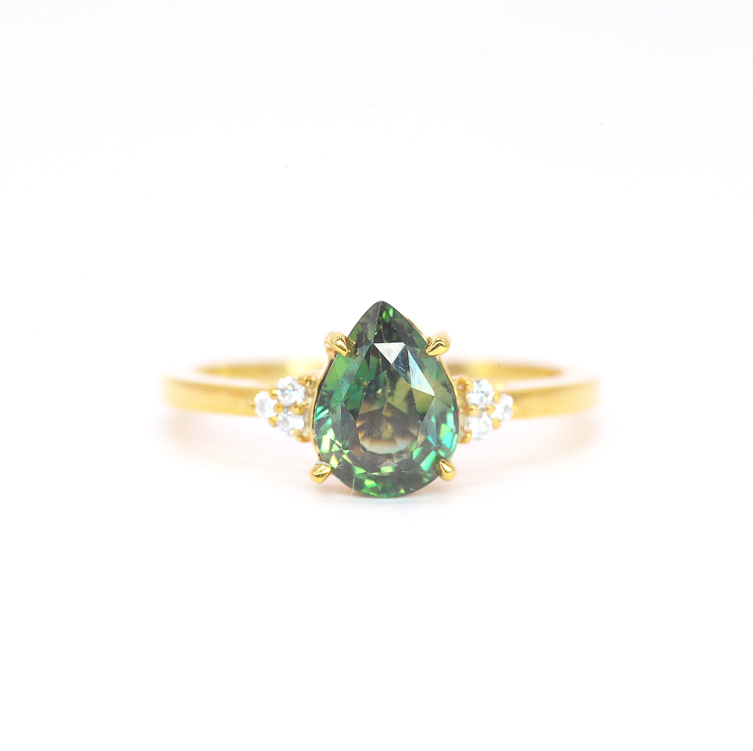 Teal sapphire and minimal diamond cluster ring with 8 x 6mm natural teal sapphire and accent diamonds. The unique design of this art deco style ring comes with solid 9k,14k or 18k gold or platinum.