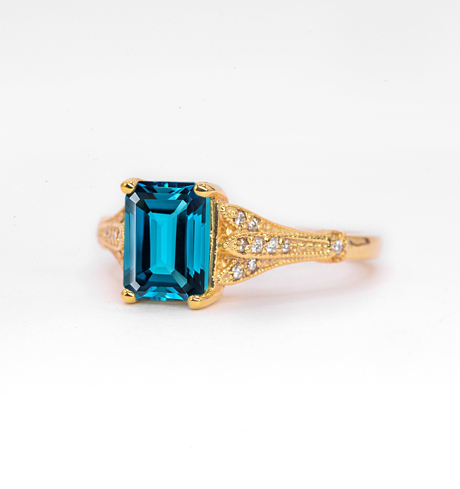 Emerald cut blue topaz and diamond ring for wife. This unique bespoke engagement ring comes with any solid 9k,14k or 18k gold or platinum.