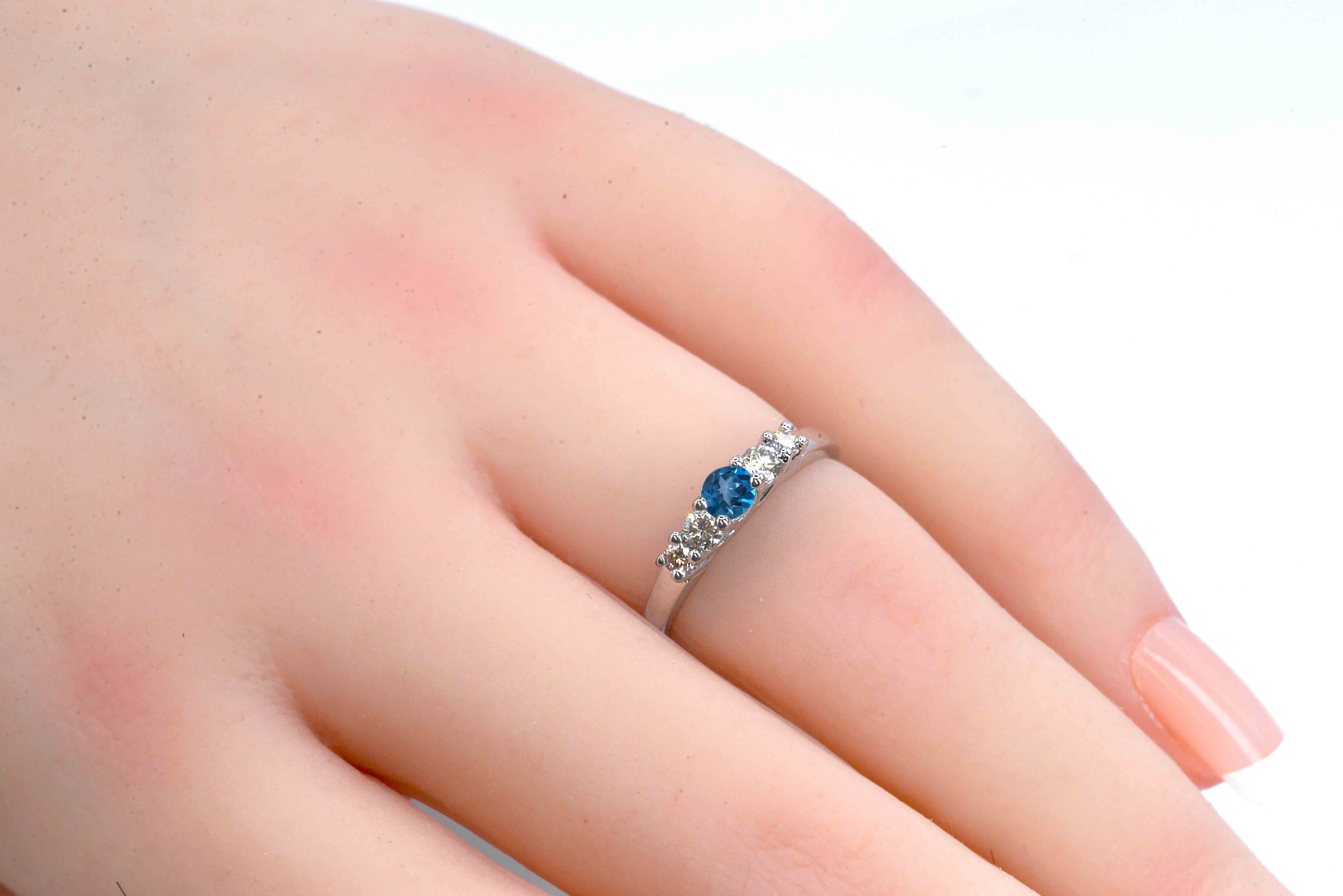This natural blue topaz and diamond ring featuring round natural blue topaz and white diamonds. A beautiful and elegant ring for engagement or any other occasion. Available in rose gold, yellow gold, white gold, or platinum.