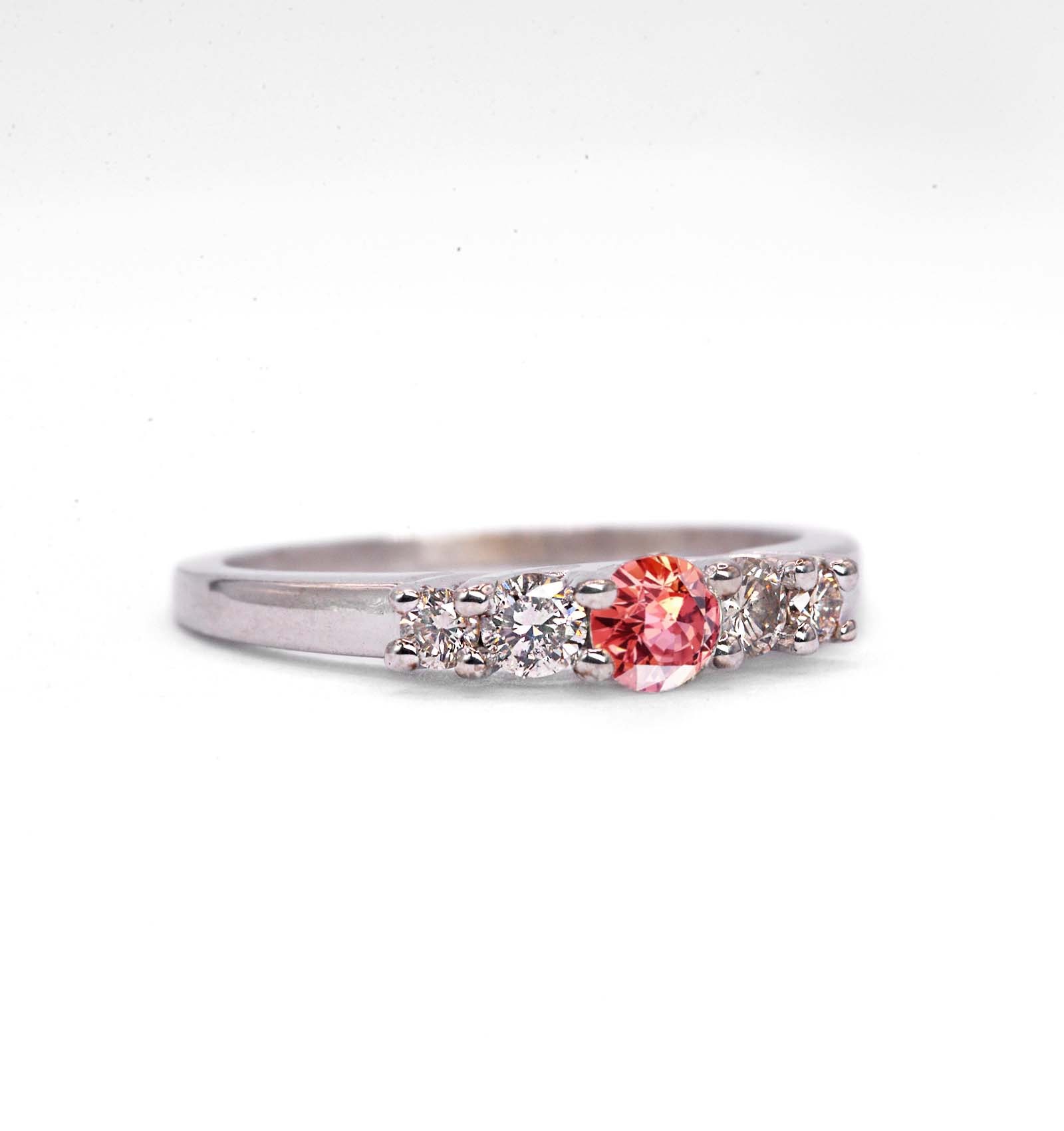 Padparadscha sapphire and diamond ring for her with padparadscha sapphire and white diamonds. This unique ring comes in 9k,14k or 18k rose gold.