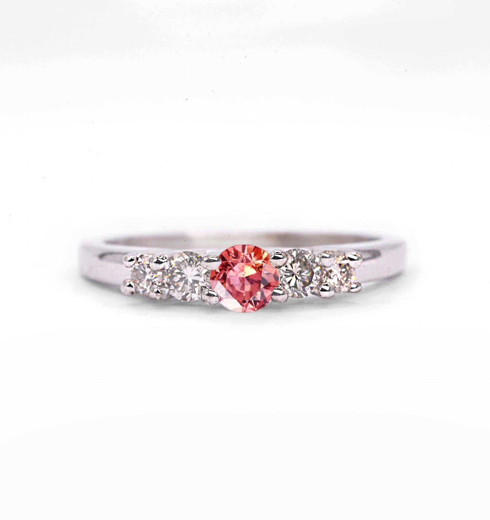 Padparadscha sapphire and diamond ring for her with padparadscha sapphire and white diamonds. This unique ring comes in 9k,14k or 18k rose gold.