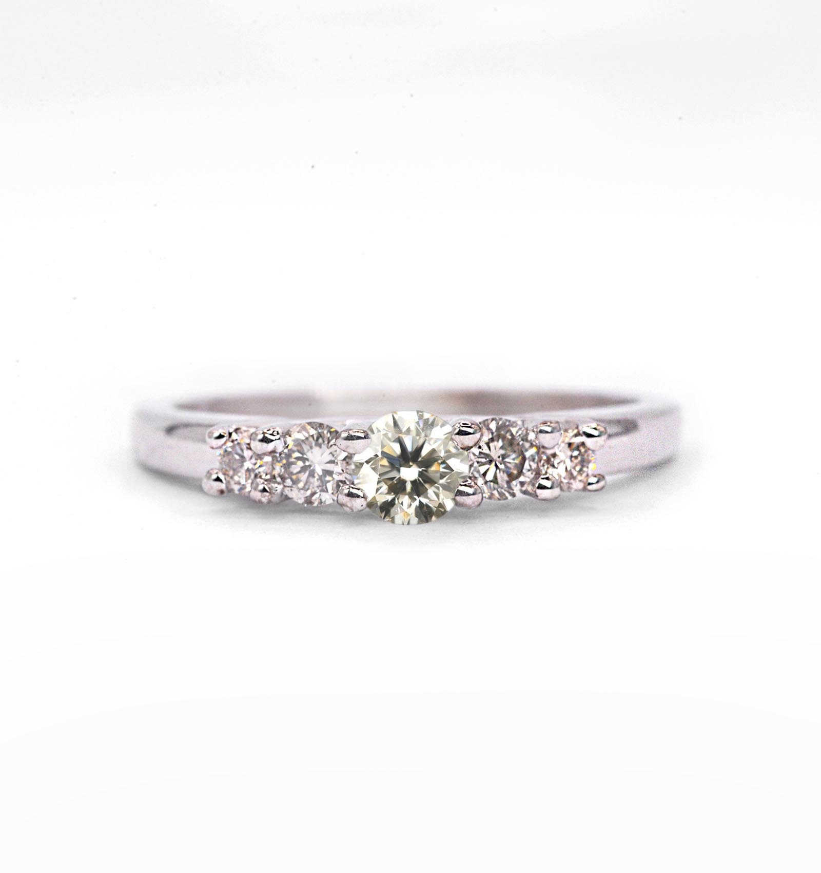 Round diamond vintage anniversary ring with lab grown diamond and white diamonds. The unique art deco style ring comes with solid 9k,14k or 18k gold or platinum.