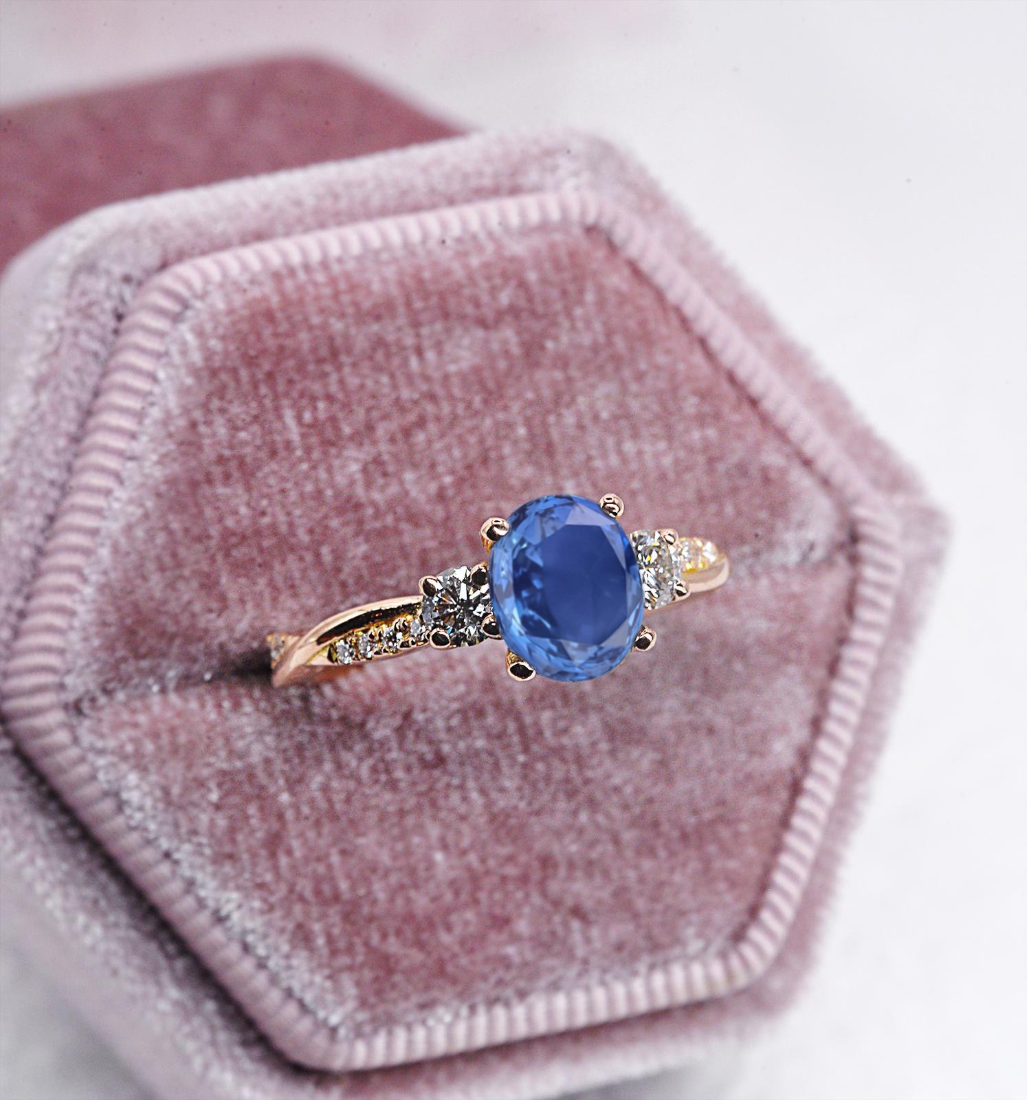 1.57ct oval blue sapphire and diamond engagement ring