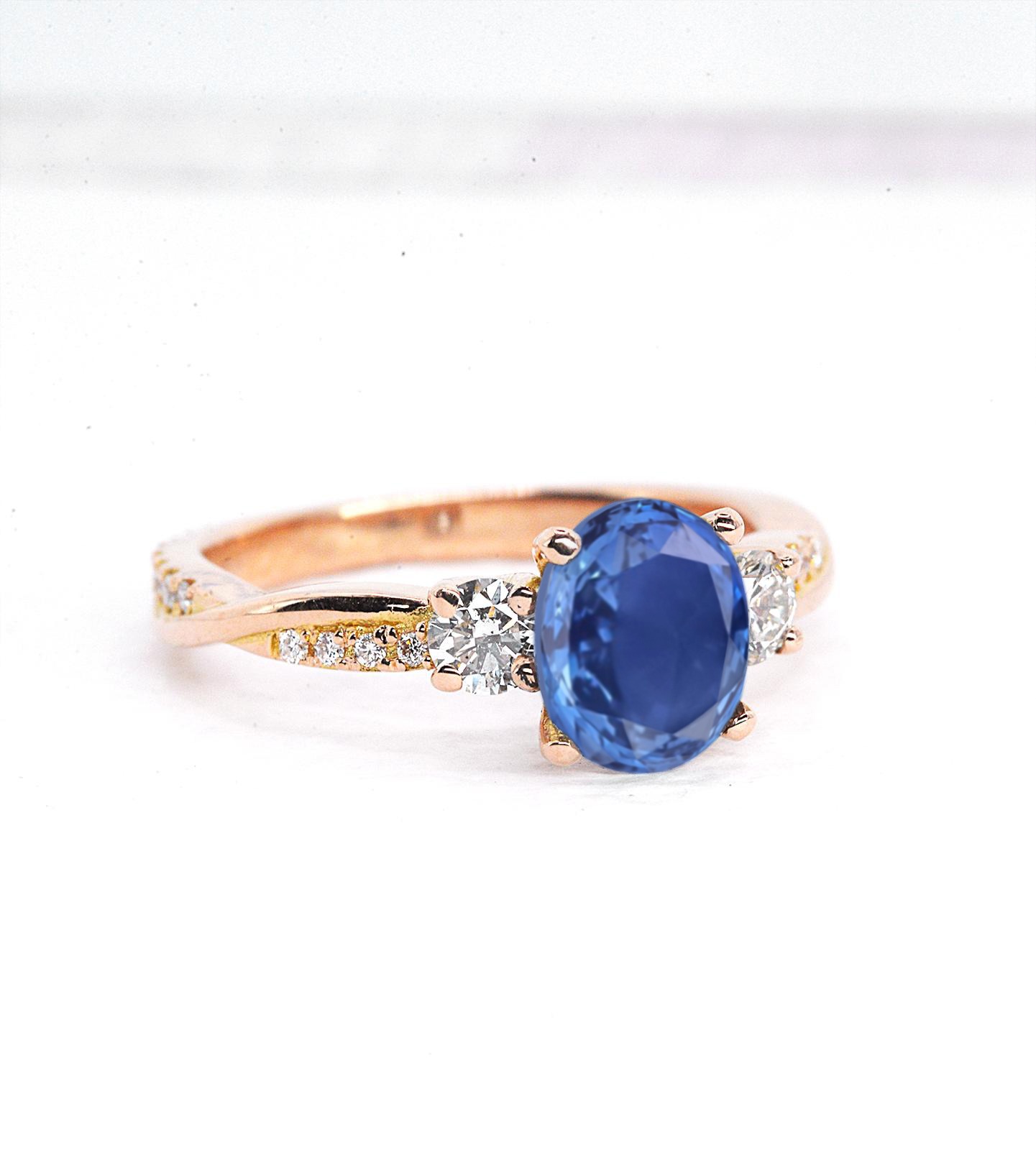 1.57ct oval blue sapphire and diamond engagement ring