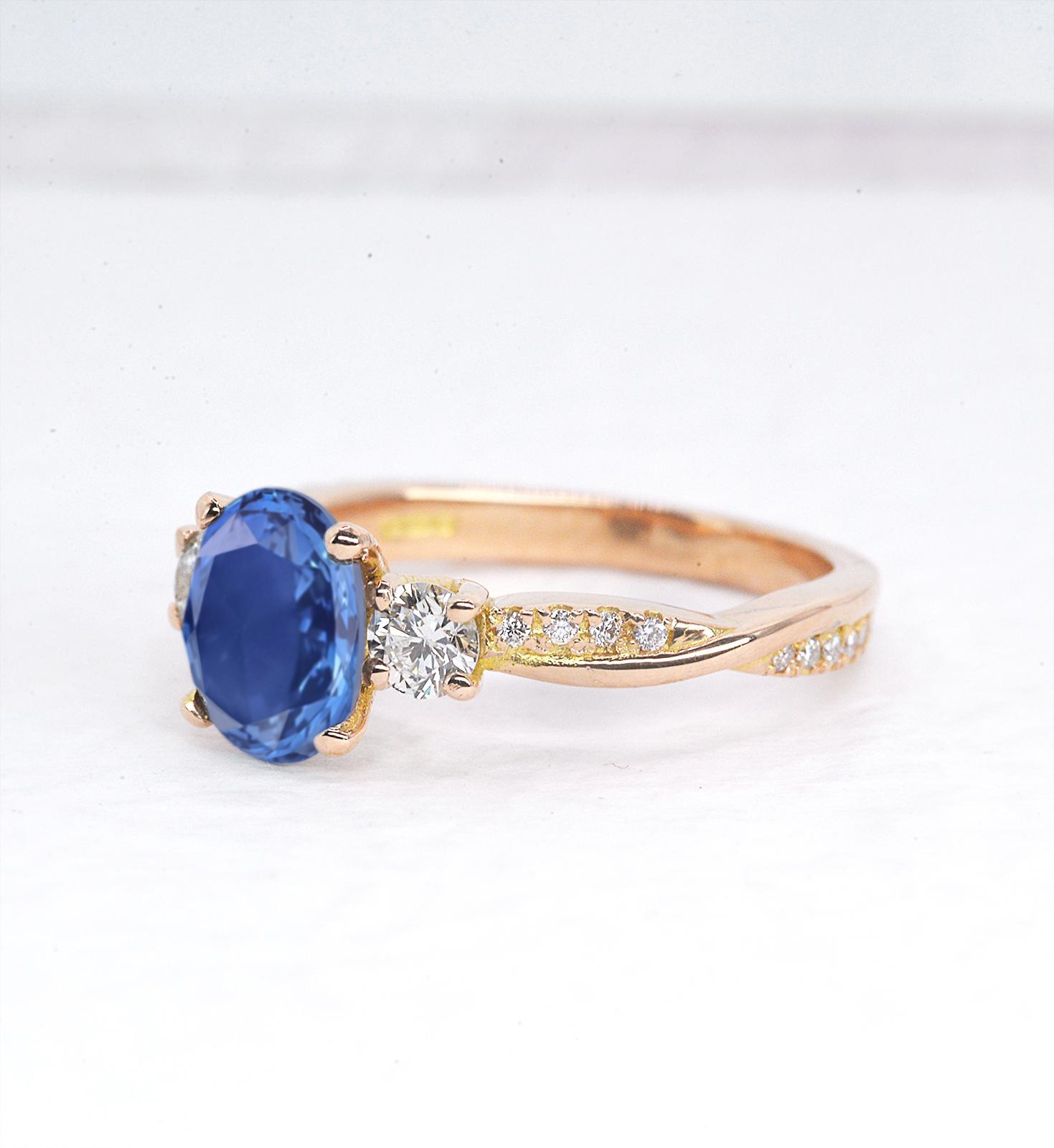 1.57ct oval blue sapphire and diamond engagement ring