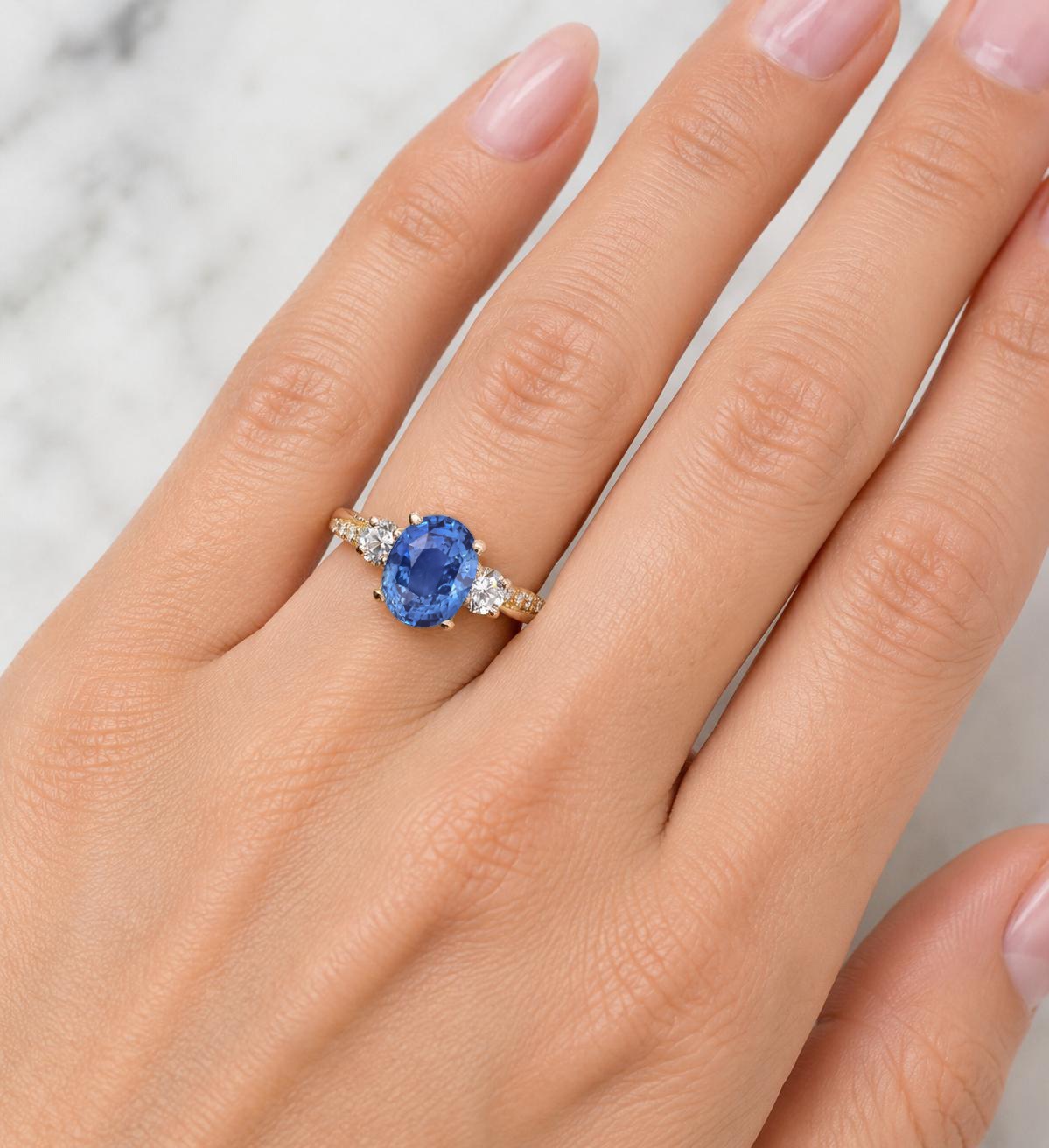 1.57ct oval blue sapphire and diamond engagement ring